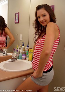 Sweet teenage babe shows tits in bathroom