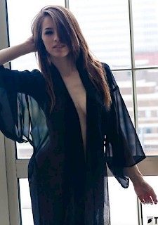 cute girl Caitlin McSwain strips out of her black robe for you