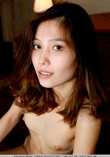 Asian cute girl Anna Aki strips nude in her first photo shoot